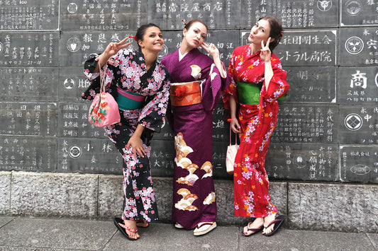 Ladies wearing colorful yukatas and kimono.